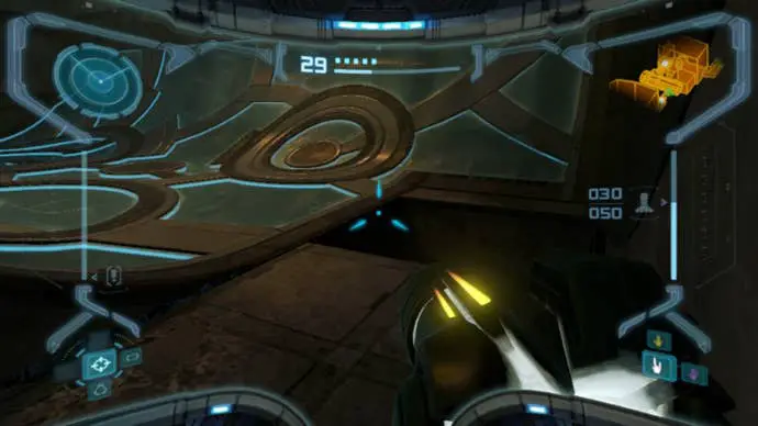 Samus apunta al desagüe de bombas en Metroid Prime Remastered, que muestra un bote de energía