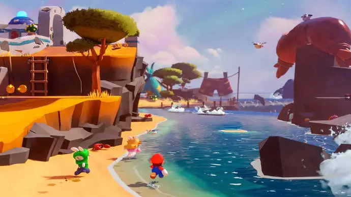 En Mario + Rabbids Sparks of Hope, Mario, Rabbid Peach y Rabbid Luigi corren por la playa.