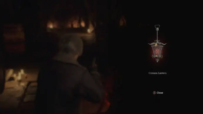 Leon recupera el Crimson Lantern de un cadáver en el remake de Resident Evil 4
