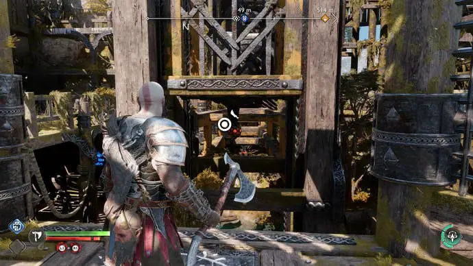 Kratos usando su Chaos Blade para tirar de un ascensor en la plataforma minera de Artyoff en Ragnarok