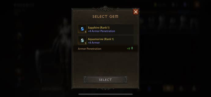 La pantalla de ranura de gemas de elementos secundarios en Diablo Immortal, que muestra gemas azules zafiro y aguamarina