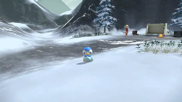 Piplup sentado en la nieve en Camp Arceus en Pokémon Legends